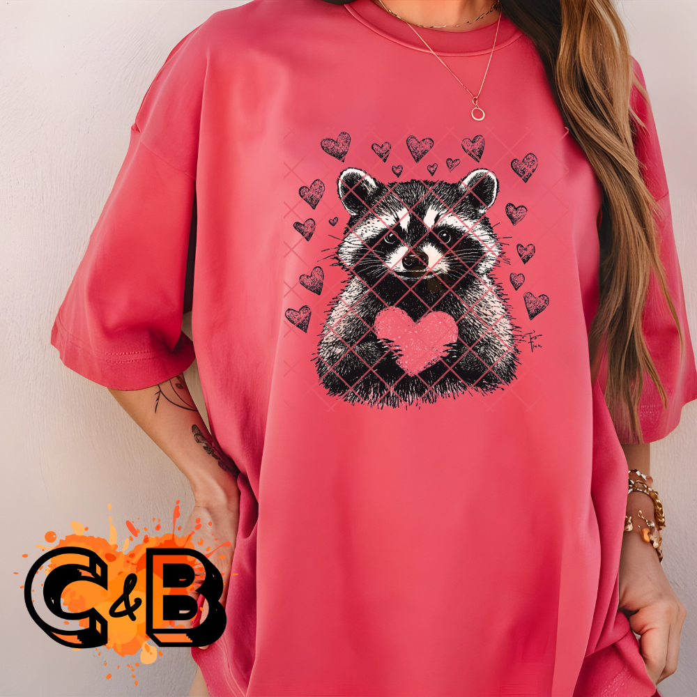 Raccoon holding heart DTF film t shirt transfer